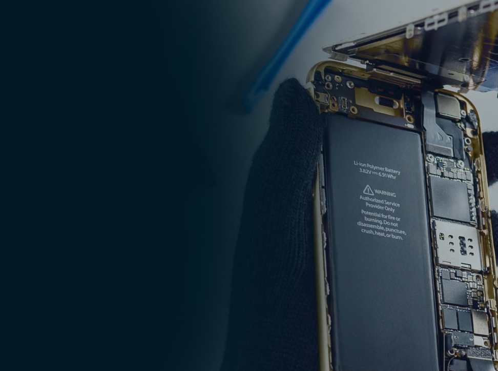 Close-up of a smartphone with its back cover removed, revealing the internal components and battery.